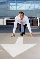 arrow pointer and handsome businessman ready for race