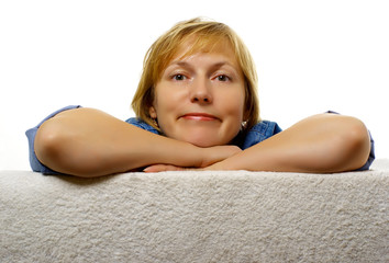 Middle-aged woman looks forward with a smile