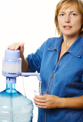 Middle-aged woman with glass of clean healthy water