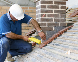 Close-up of trainee roofer on mock building site - 8826523
