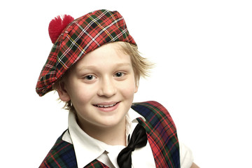 Good looking little stotsman on white background
