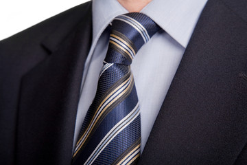 detail of a business man suit with blue tie