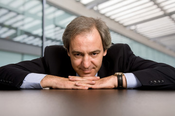 mature business man on a desk at the office