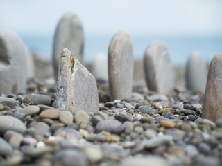 stone rows on pebble beach focus on the nearest stone