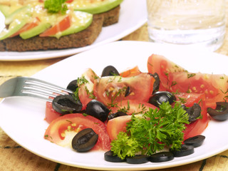 vegetarian diner - salad with tomatos and sandwich with cheese