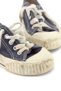 An old worn pair of children's shoes.