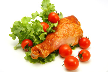 served turkey leg with lettuce and cherry tomatoes