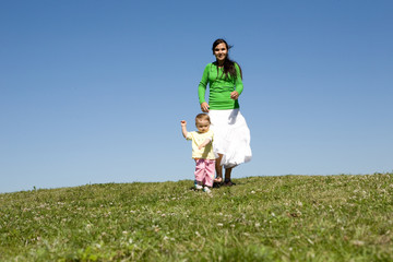 active family on green meadow