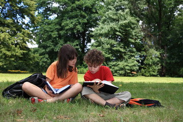 Kids reading book outdoor