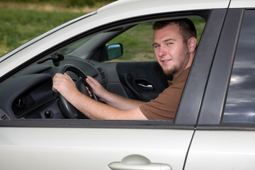 happy man traveling by car