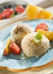 fresh ice cream scoops on plate close up