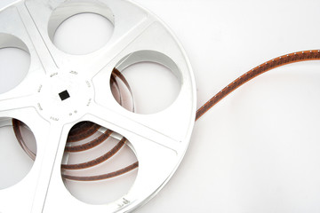 Vintage movie film and reel on white