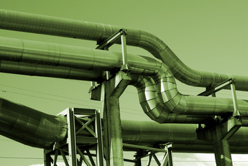 industrial pipelines on pipe-bridge against sky black and white