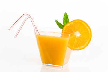 orange juice decotated with mint leaves isolated