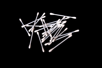 White wadding swabs on black background