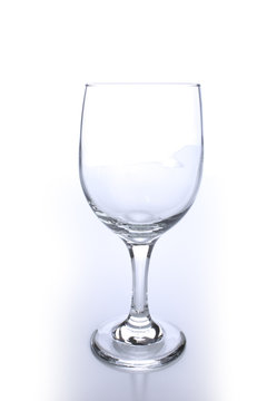 Empty crystal wine glass with light reflection