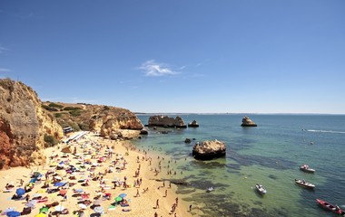 Obraz premium Tourism near Lagos in the Algarve in Portugal in summertime