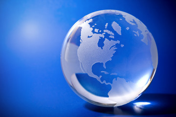 Fototapeta na wymiar Backlit blue globe with copyspace