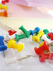 colorful push pins and sheets