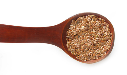 Flax seeds in wooden spoon