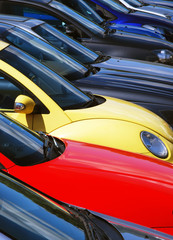 Telephoto view of cars parked in parking lot