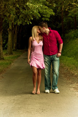 Obraz premium young couple in love walking and kissing
