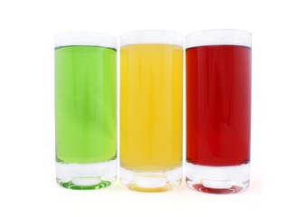 Three classic glasses with coloured juice isolated on white