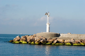 Fototapeta na wymiar A smaill lighthouse for sea traffic