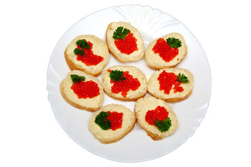 Small russian sandwiches with bread, butter and red caviar