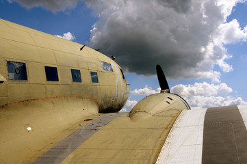 Vintage propeller airplane facing the sky