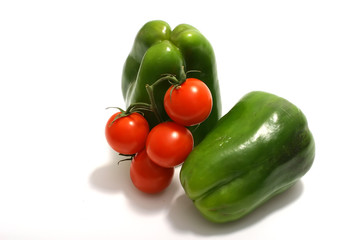 two sweet green bell pepper and cherry tomatoes