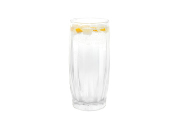 A cold water glass with lemon isolated on white.