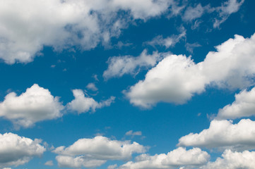 Naklejka na ściany i meble white clouds over deep blue sky background