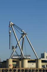 Fototapeta na wymiar Stationary heavy-lift crane at a harbour.