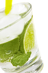 Refreshing cold Mojito Cocktail against a white background.