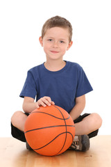 6-7 years old boy with basketball