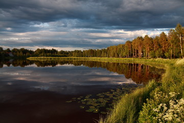 Fototapeta premium Lake at sunset with reflection in Finland