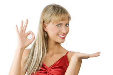 Fototapeta premium attractive and smiling woman in red dress presenting a product