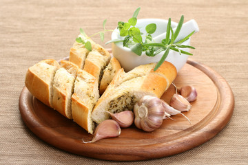 garlic baguette with fresh herbs and butter