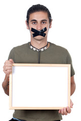 Mute boy holding poster a over white background