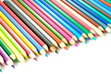 coloured pencils with shadow on white background..