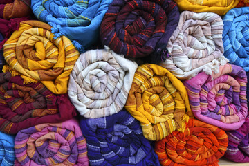 Indian fabrics rolled with high colors