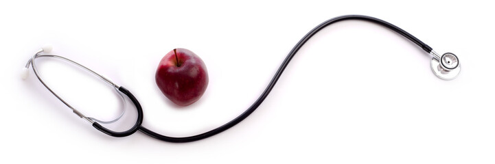A doctor or nurses stethoscope and a apple on a white background