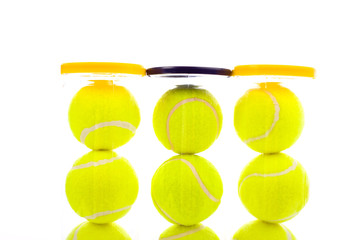 Several tennis balls on a white background with copy space