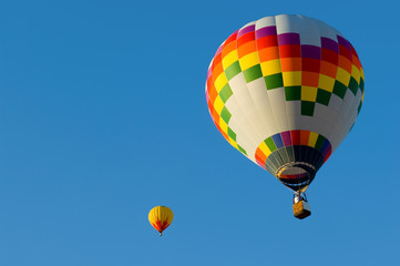 A hot air balloon with a blue sky background