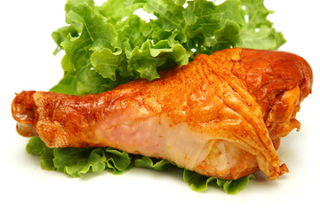 hot roasted turkey leg served with green lettuce