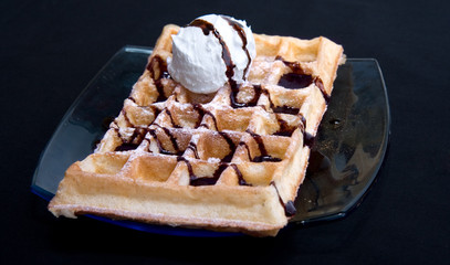 waffles with cream  isolated on black background