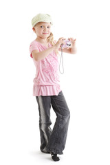 Young girl taking a photo with her digital camera