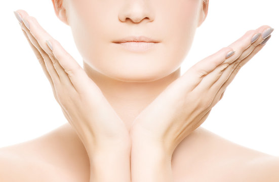 Woman's face and hands isolated on white background