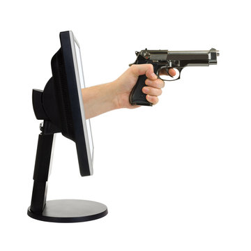 Computer monitor and hand with gun isolated on white background
